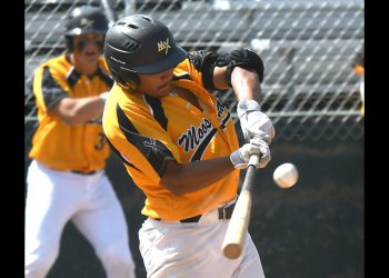 Dougie DelaCruz hits a single up the middle to bring home Chaz Poppy with Moose Jaw’s second run. Randy Palmer