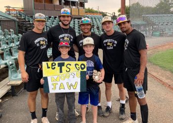 Some Miller Express players posing with a couple of fans prior to Tuesday's playoff game in Swift Current. (Photo credit: Moose Jaw Miller Express/Facebook)