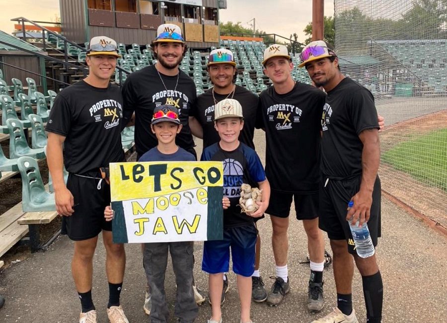 Some Miller Express players posing with a couple of fans prior to Tuesday's playoff game in Swift Current. (Photo credit: Moose Jaw Miller Express/Facebook)